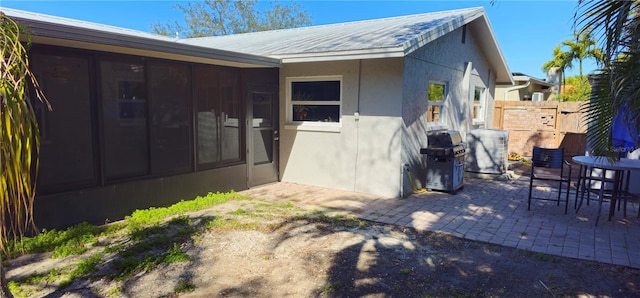 property entrance with a patio area