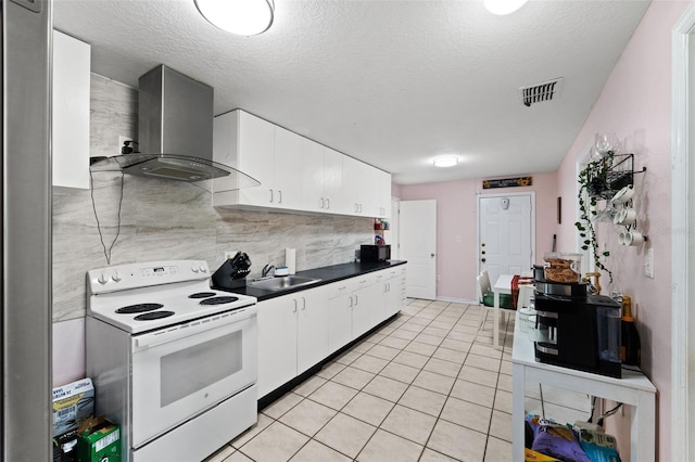 kitchen featuring white cabinets, wall chimney exhaust hood, sink, and electric stove