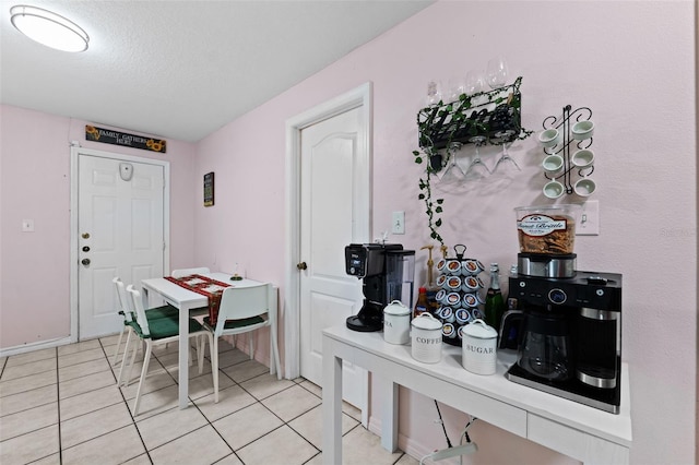 3336 W Heiter St, Tampa, FL 33607 - dining space featuring light tile patterned floors and a textured ceiling