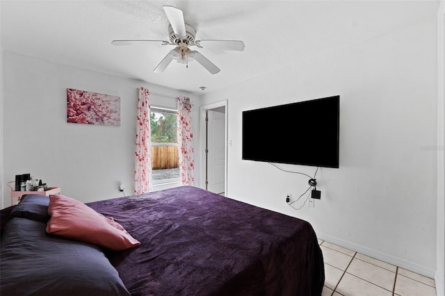 3336 W Heiter St, Tampa, FL 33607 - bedroom with baseboards, light tile patterned floors, and ceiling fan
