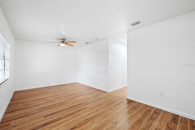 spare room with light hardwood / wood-style floors and ceiling fan