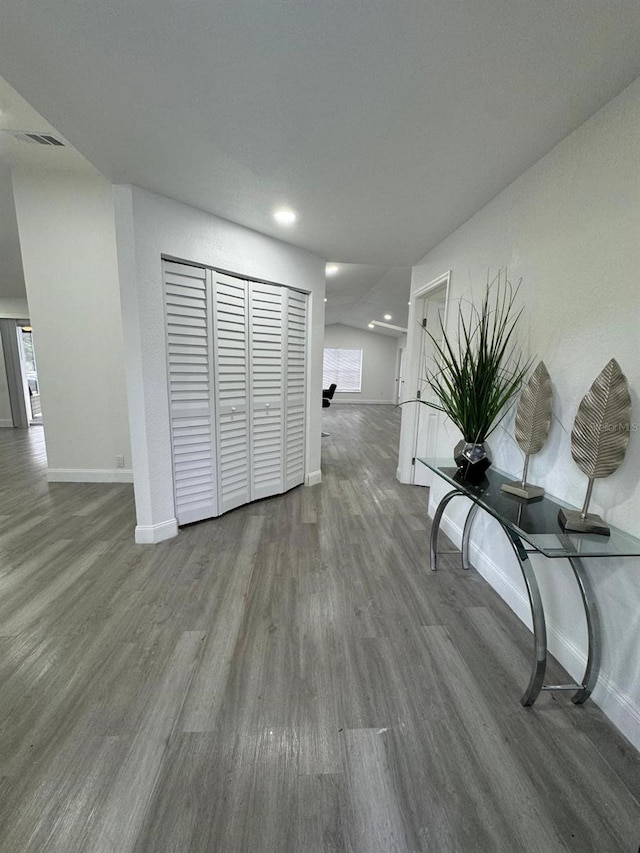 hallway with hardwood / wood-style floors