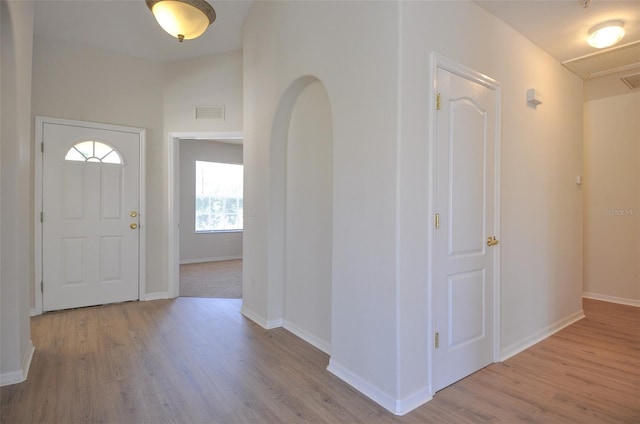 entryway with light hardwood / wood-style floors