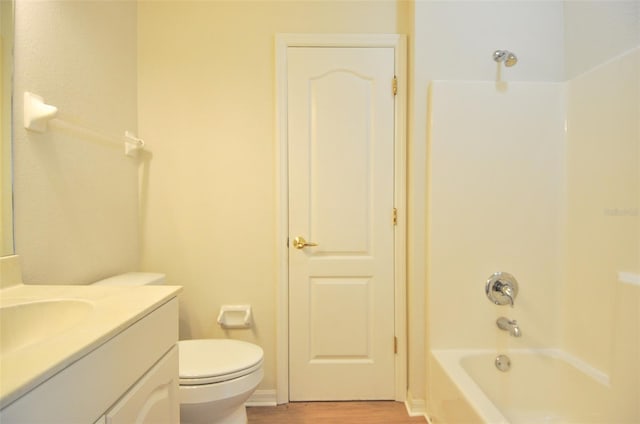 full bathroom with vanity, shower / bathing tub combination, toilet, and hardwood / wood-style flooring