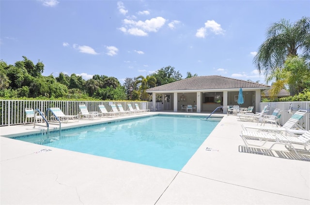 view of swimming pool featuring a patio area