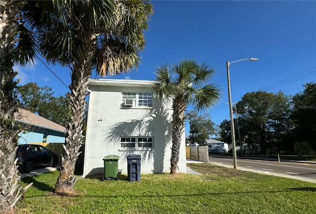 view of side of property featuring a yard