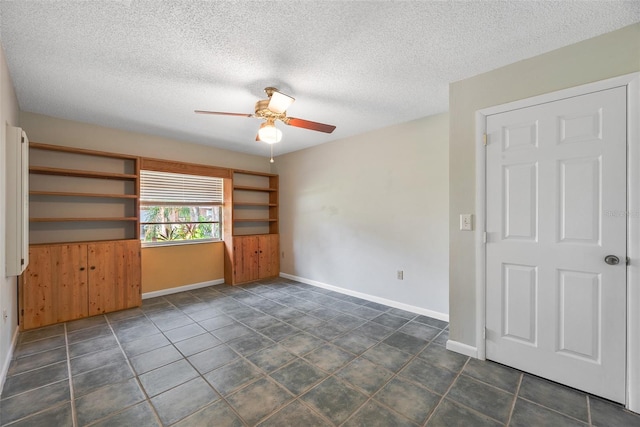 interior space featuring a textured ceiling and ceiling fan