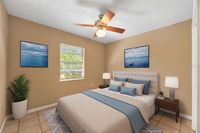 bedroom featuring light tile patterned flooring and ceiling fan