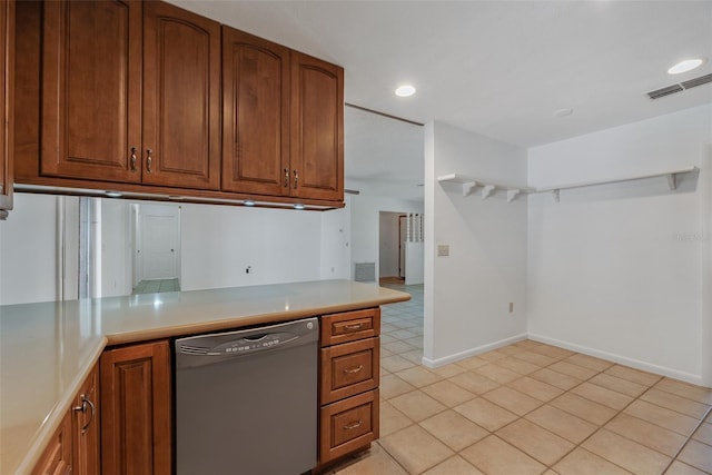 kitchen with light tile patterned flooring and dishwasher