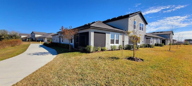 view of side of property featuring a yard