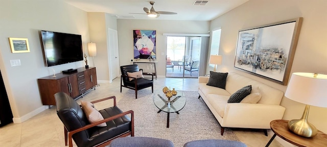 living room featuring ceiling fan and light tile patterned floors