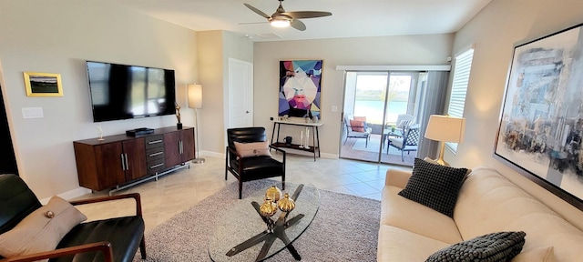 tiled living room with ceiling fan