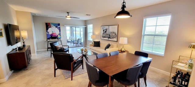 dining space featuring ceiling fan and light tile patterned floors