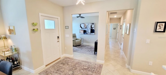 entryway with light tile patterned flooring