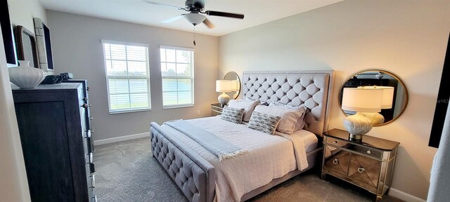 bedroom with ceiling fan and carpet floors