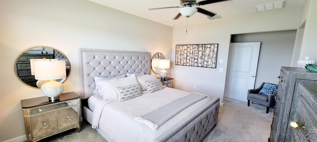 bedroom with ceiling fan and light colored carpet