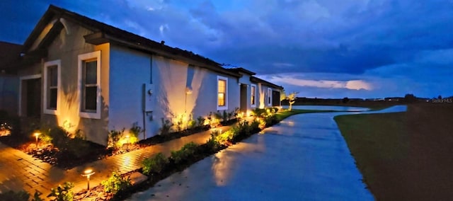 view of property exterior at dusk