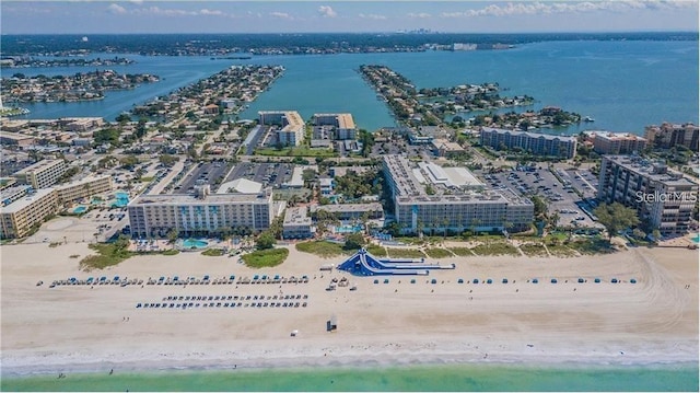 birds eye view of property featuring a water view and a view of the beach