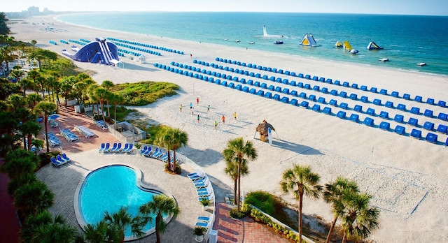 bird's eye view featuring a beach view and a water view