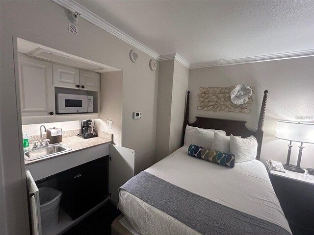 5500 Gulf Blvd Unit 2237, St Pete Beach, FL 33706 - bedroom featuring a sink and ornamental molding