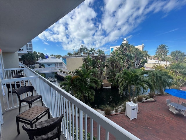 balcony featuring a water view