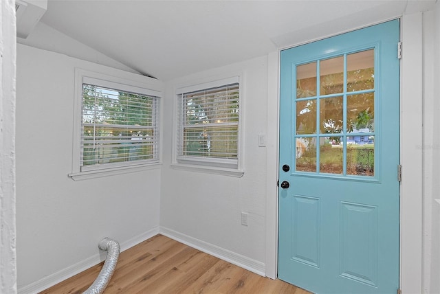 entryway featuring vaulted ceiling and light hardwood / wood-style floors