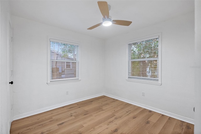 spare room with ceiling fan and light hardwood / wood-style flooring