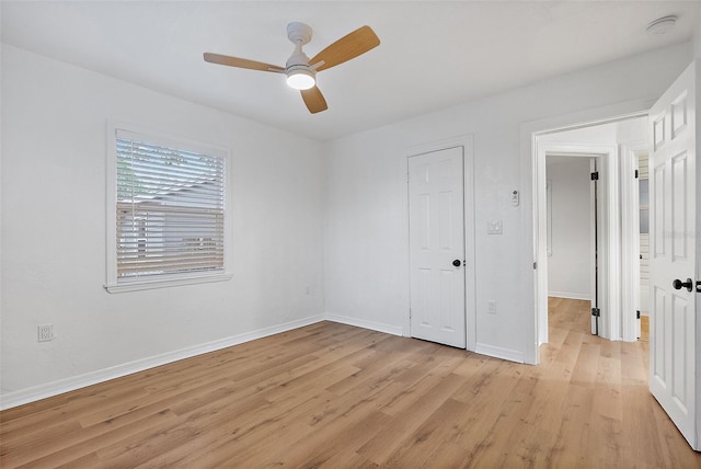 unfurnished bedroom with ceiling fan, light hardwood / wood-style floors, and a closet