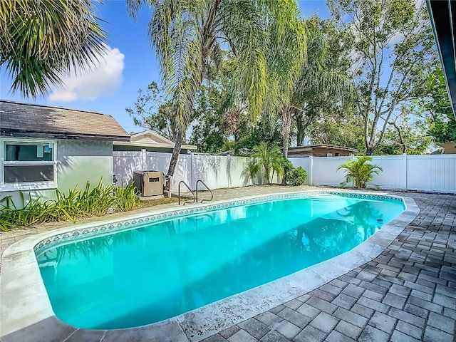 view of swimming pool featuring a patio area