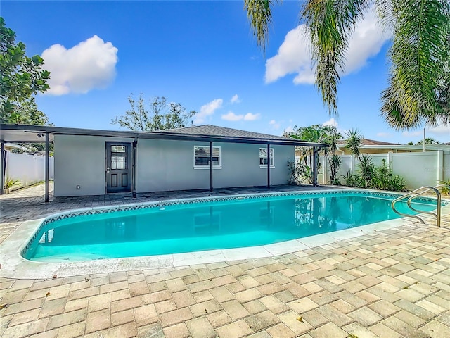 view of swimming pool featuring a patio area