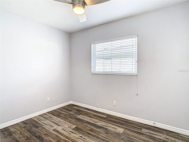 unfurnished room featuring ceiling fan and dark hardwood / wood-style floors