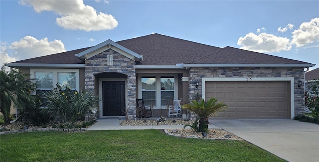 view of front of home featuring a garage and a front yard