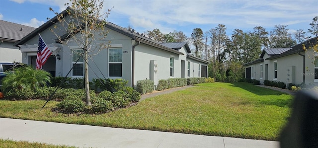 view of property exterior with a lawn