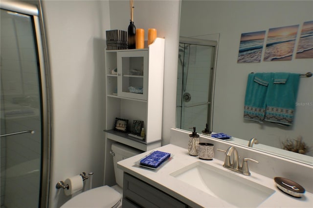 bathroom with walk in shower, vanity, and toilet