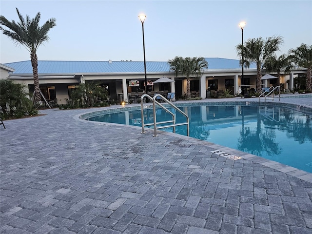 view of pool featuring a patio area