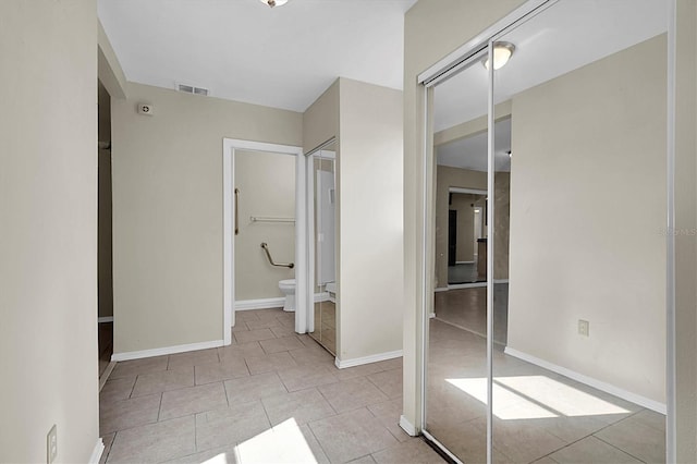 bathroom featuring tile patterned floors and toilet