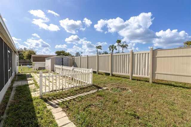 view of yard with a storage shed