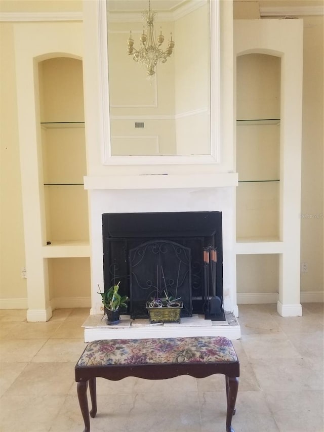 details featuring built in shelves, a chandelier, and ornamental molding