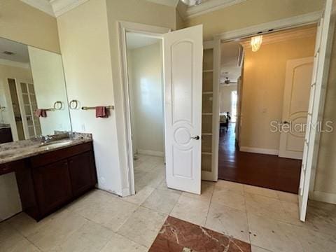 bathroom featuring vanity, ceiling fan, wood-type flooring, and crown molding