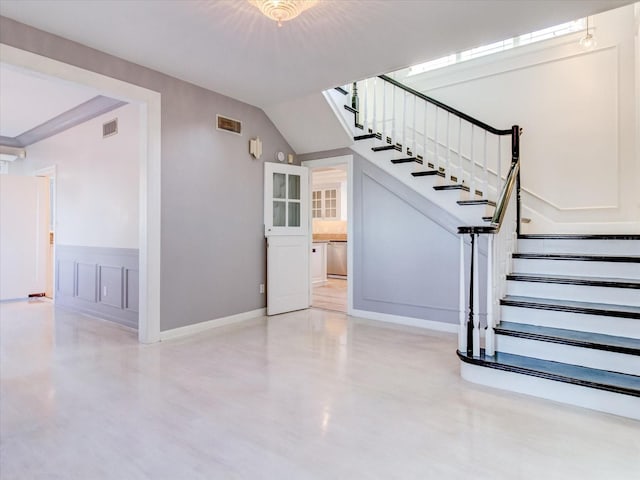 stairs with concrete flooring