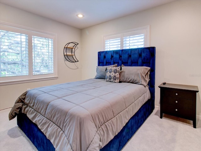 bedroom with light colored carpet