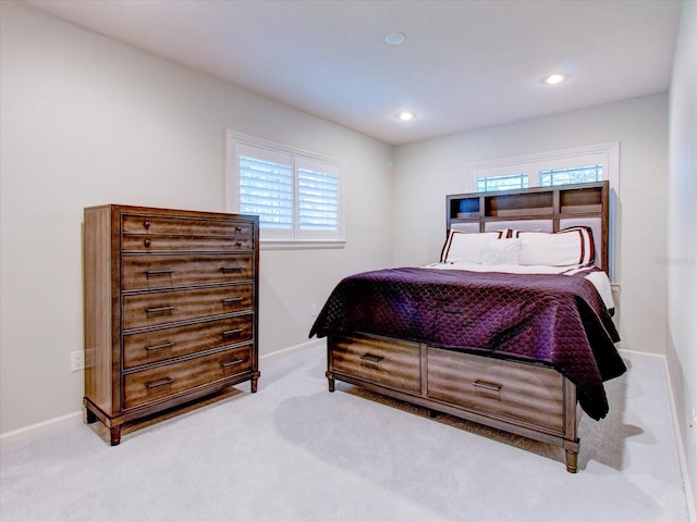 bedroom featuring light colored carpet