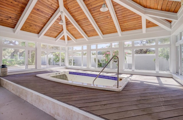 unfurnished sunroom with vaulted ceiling with beams, a hot tub, and wood ceiling