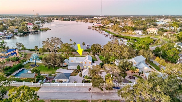 aerial view at dusk with a water view