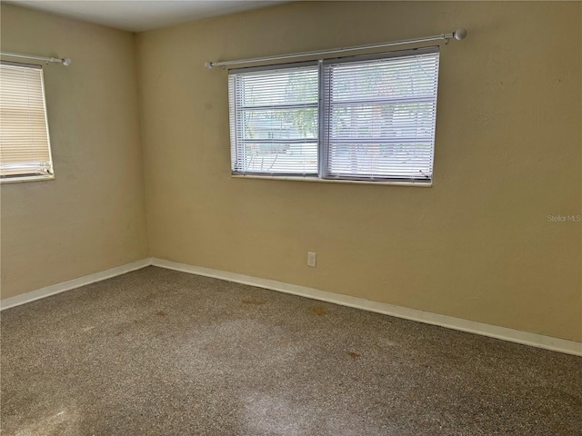 unfurnished room with carpet flooring