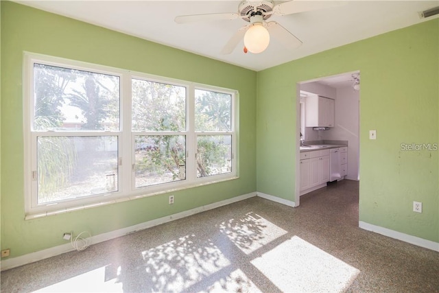 unfurnished room with ceiling fan