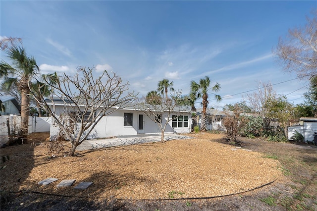 rear view of property featuring a patio area