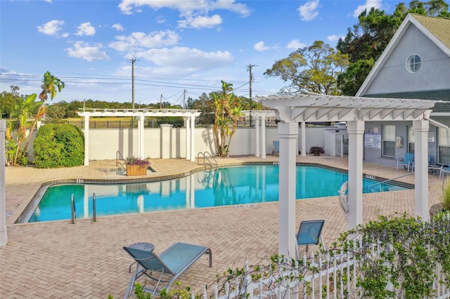 view of pool with a pergola and a patio