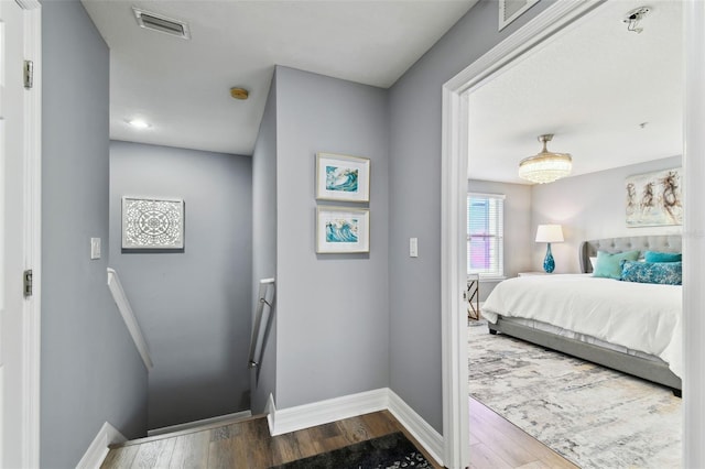 bedroom with wood-type flooring