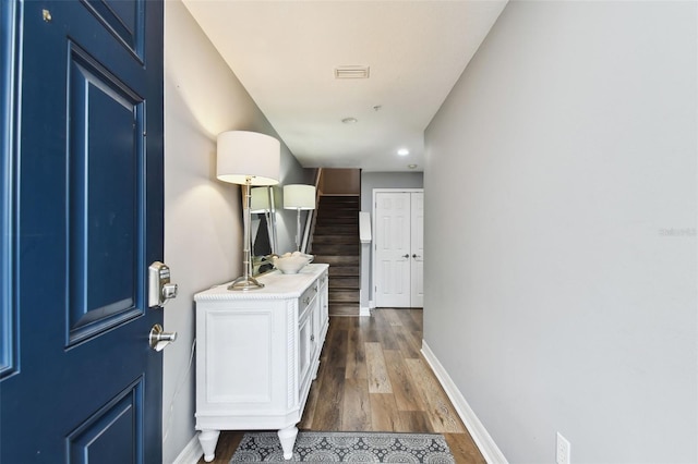 hallway featuring dark hardwood / wood-style flooring